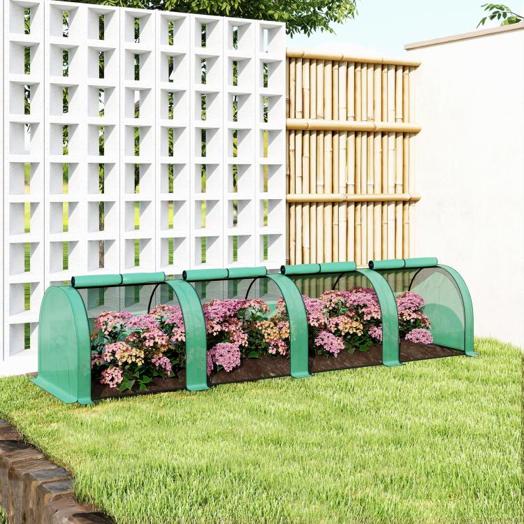 Green portable tunneled greenhouse with zippered door panels and translucent cover