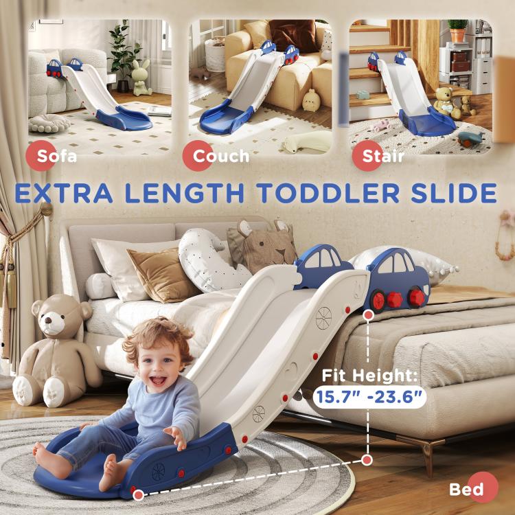 Toddler using blue-and-white extra-length slide on carpet near bed