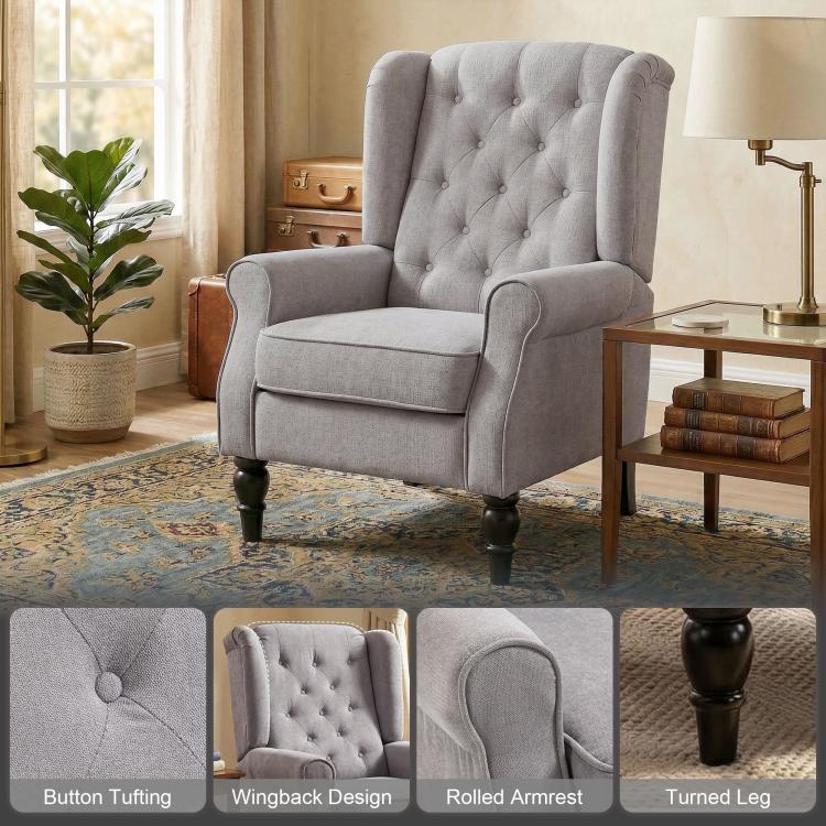 Gray wingback accent chair with button-tufted back, rolled arms, and turned legs.