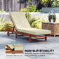 Cream outdoor chaise lounge cushion on wooden frame with attached ties