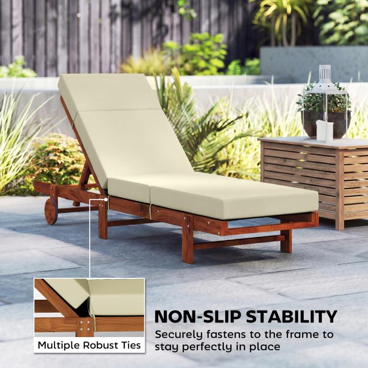 Cream outdoor chaise lounge cushion on wooden frame with attached ties