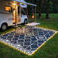 Outdoor rug with warm LED border lighting and white Moroccan-style geometric pattern