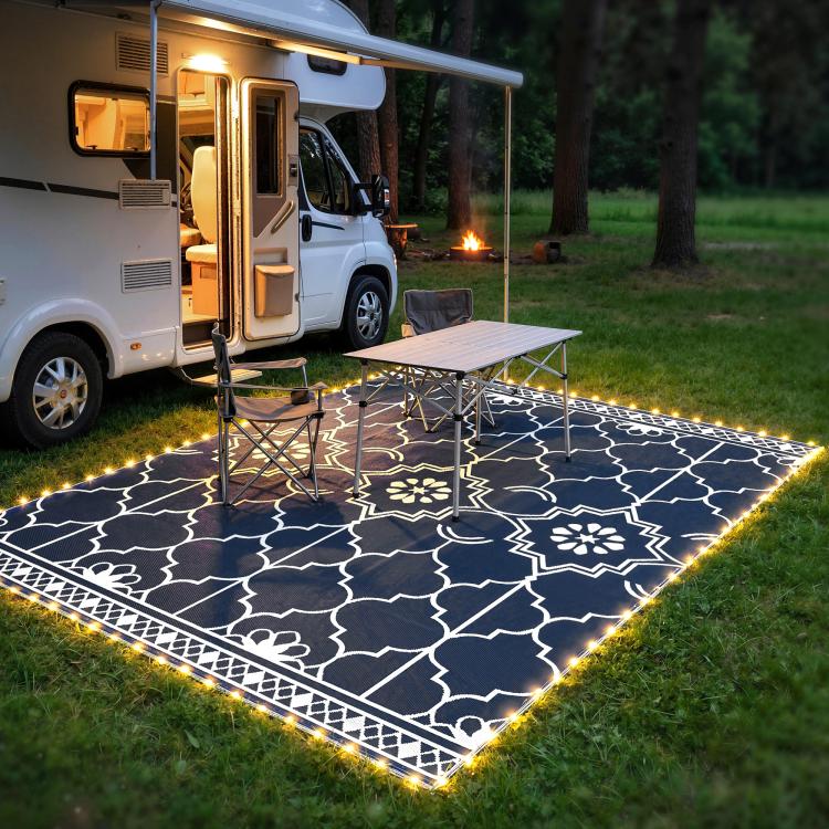 Outdoor rug with warm LED border lighting and white Moroccan-style geometric pattern