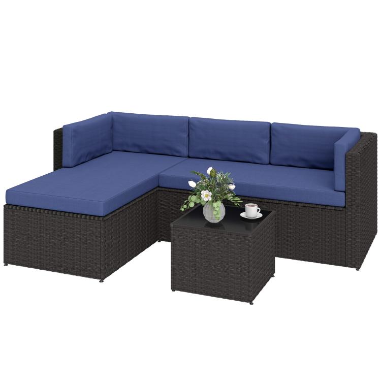 Dark wicker patio sectional with navy seat cushions and central glass-top coffee table