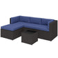 Navy-cushioned outdoor patio sectional with dark wicker frame and coffee table