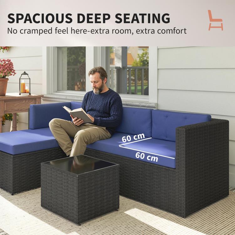 Spacious deep seating patio sectional with navy cushions and dark wicker glass-top table