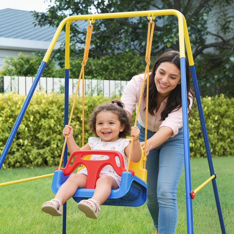 Toddler swing set with blue frame and red/yellow belt seat, child on swing
