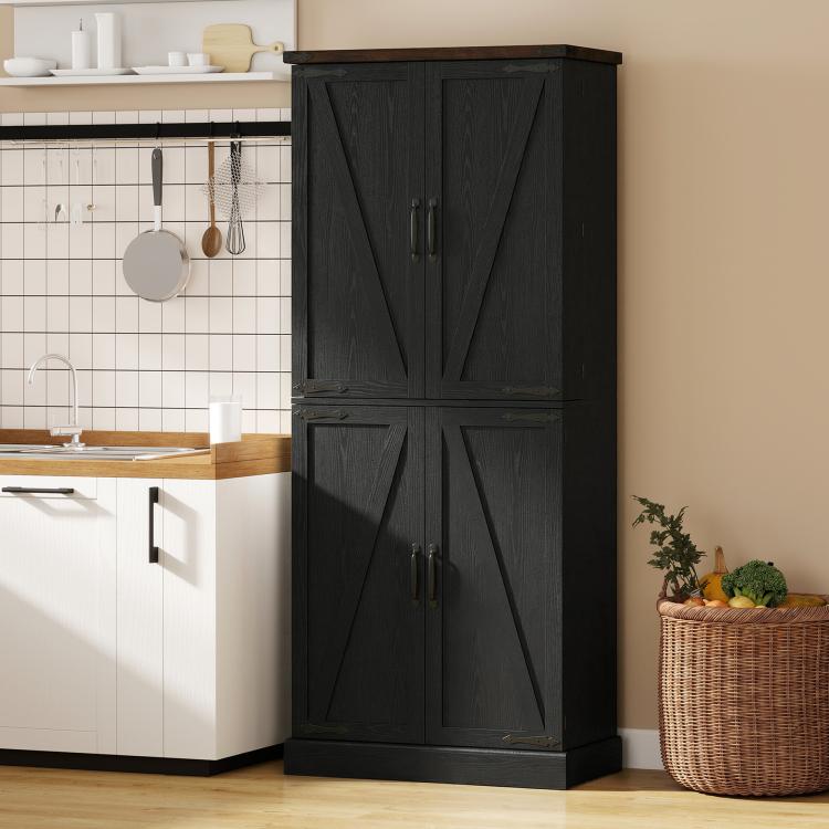 Black farmhouse pantry cabinet with barn doors, metal bar pulls, and top trim