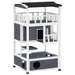 Outdoor wooden cat house, dark gray roof and panels, two levels with circular escape doors