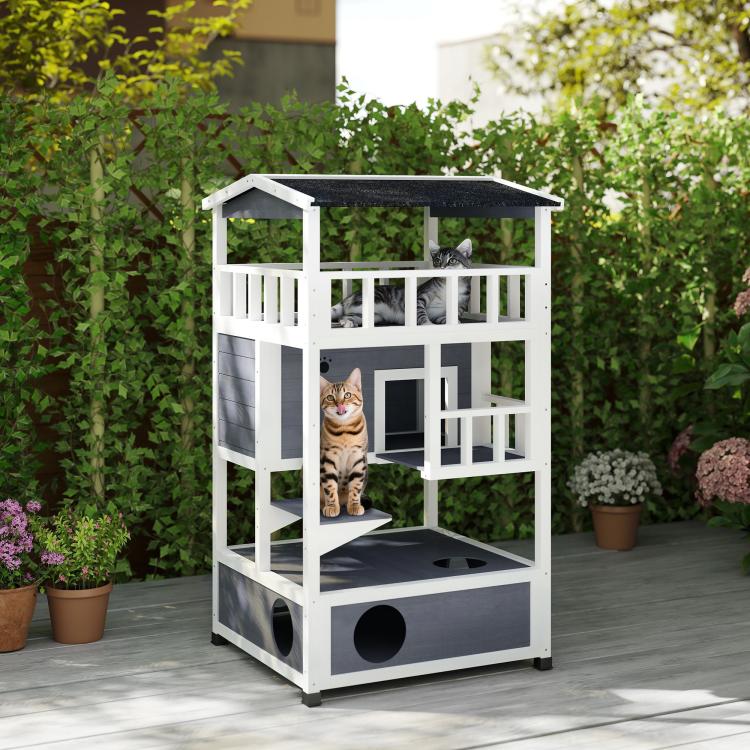 Outdoor wooden cat shelter with dark roof, front door opening, and round entry holes