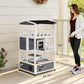 Outdoor wooden cat house kit with dark asphalt roof, stacked condos, and multiple entry doors