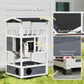 Outdoor wooden cat house with elevated base, dark asphalt eave, and waterproof finish