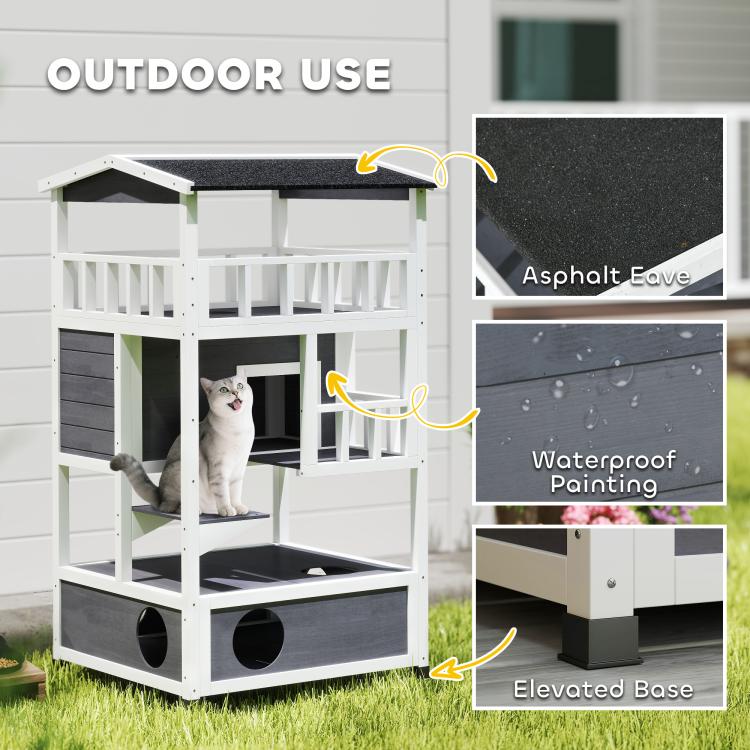 Outdoor wooden cat house with elevated base, dark asphalt eave, and waterproof finish