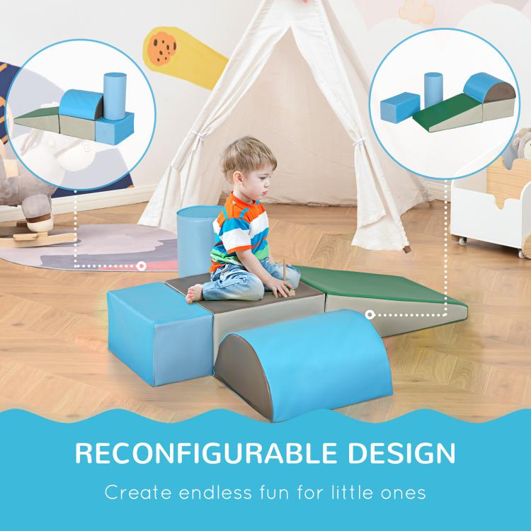 Foam climbing blocks arranged with blue tunnel, green top, and light gray steps
