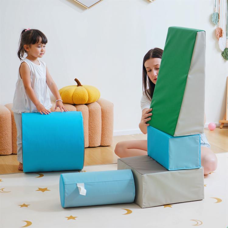 Foam play blocks stack: blue cube, gray block, and green top panel for toddlers
