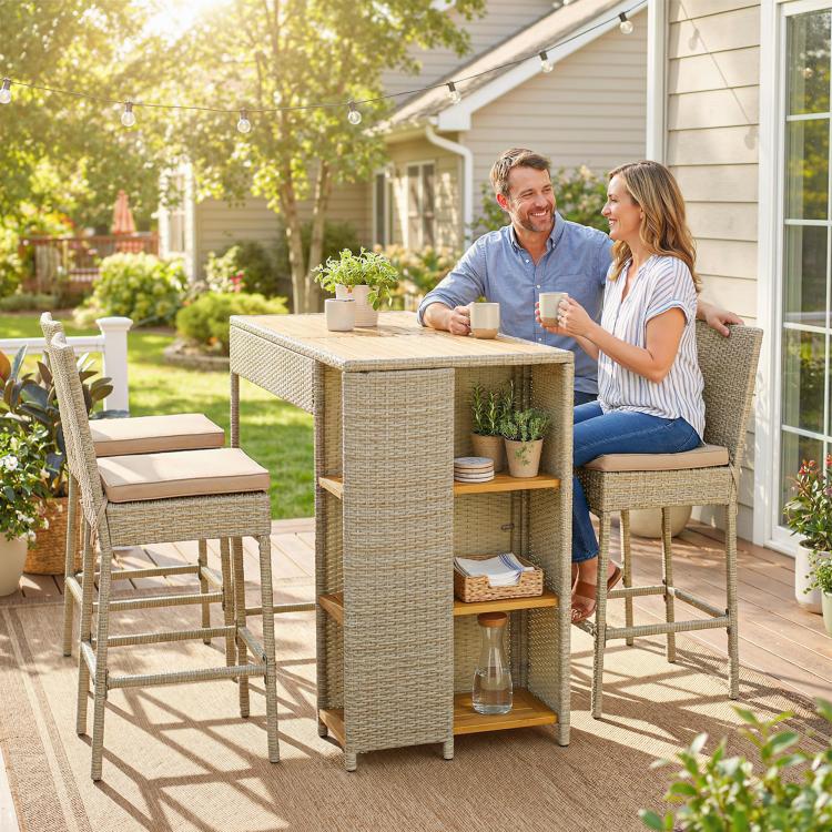 Outdoor bar height table with woven wicker cabinet and three-tier shelves with cushioned stools