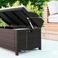 Outdoor wicker storage bench with open lid, visible hinge and side handle, dark brown