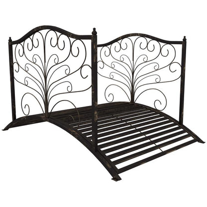 Dark bronze metal garden bridge with arched scrollwork side rails and slatted deck.