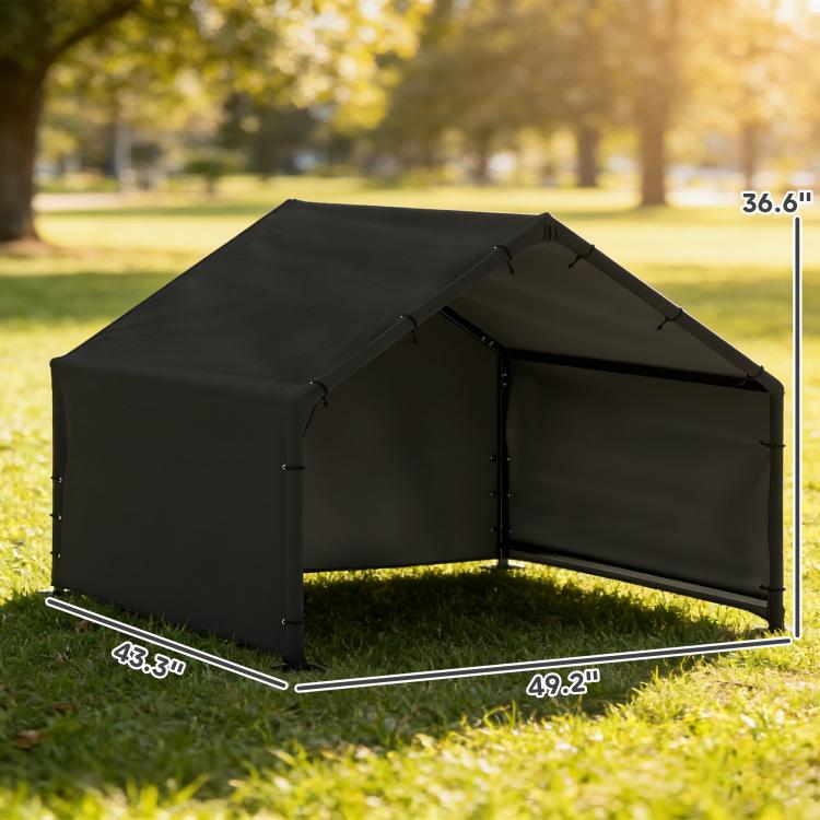 Black dog tent shade shelter with canopy roof and steel frame legs, outdoors