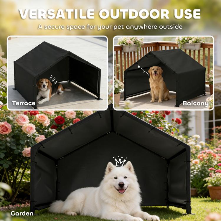 Black outdoor dog shelter tent with canopy roof and open front, dog outside on patio