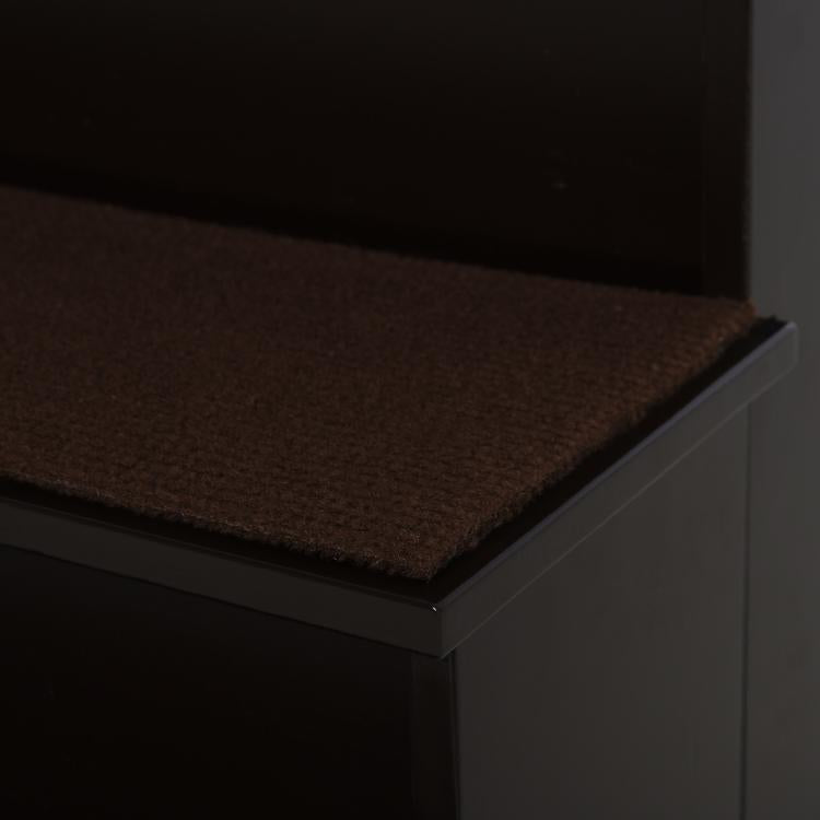 Small pet stairs with brown cushioned top step and dark step frame