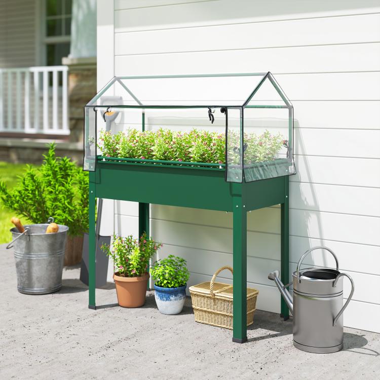 Green raised garden bed with clear greenhouse cover and mounted zip opening