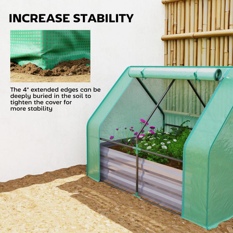 Green galvanized raised garden bed with mini greenhouse cover, plants inside