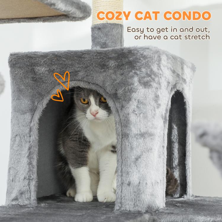 Cozy dark gray cat condo with open entrance and fuzzy cover; kitten peeking inside.