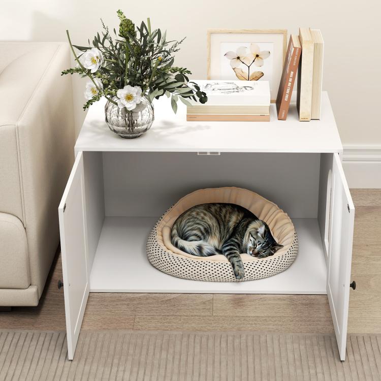 White cat litter box enclosure with built-in pet bed inside and side doors