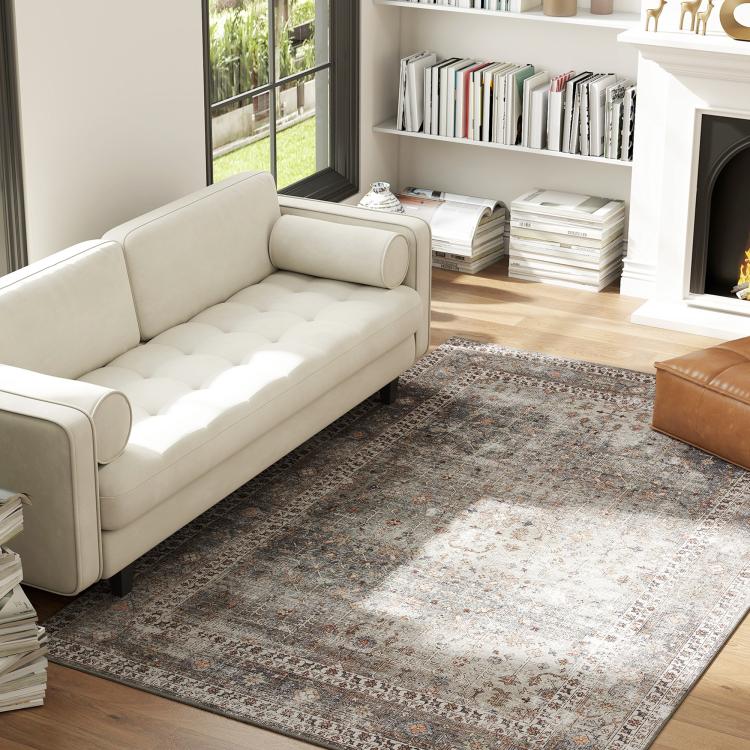 Traditional area rug with distressed gray and rust-brown motif pattern, rectangular