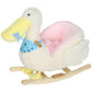 White plush duck rocking horse with blue star bib and pink seat, side view on rockers