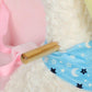 Plush rocking duck horse with blue star-and-moon saddle and light wood rocker