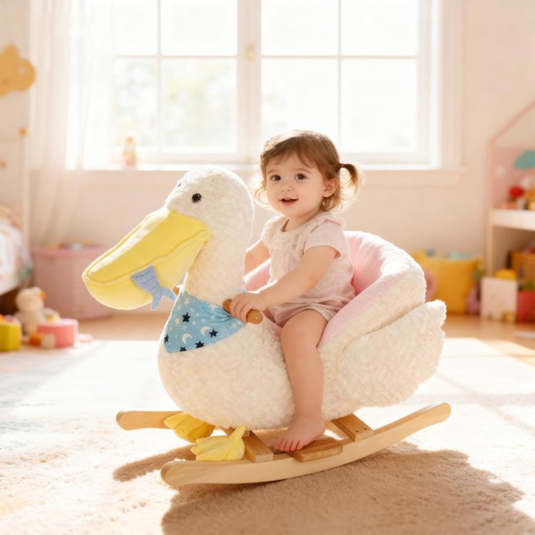 White plush duck rocking horse with pink seat and blue star bib on wooden rockers
