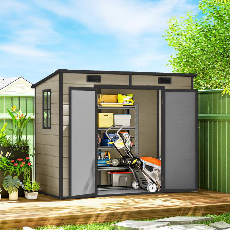 Light brown plastic shed with open doors and visible yard equipment inside