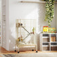 Beige wire small animal cage on rolling stand with ramps and platforms, in room