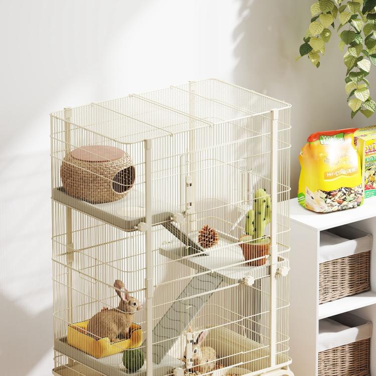 Beige wire small animal cage with ramps, platforms, and deep base tray, corner view