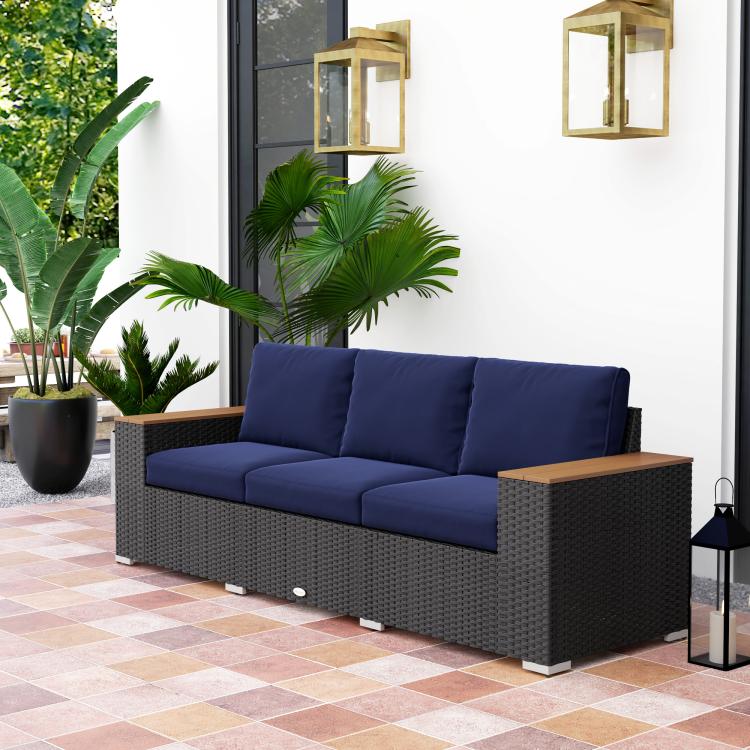 3-seat outdoor sofa with navy cushions, dark gray wicker weave, and wood-look armrests