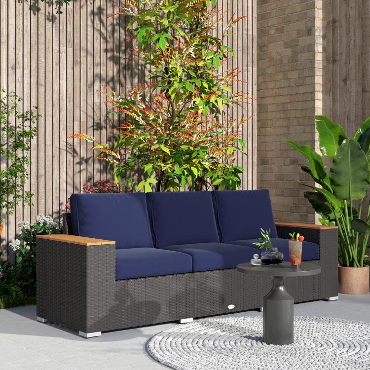 3-seat outdoor sofa with navy back cushions and dark gray wicker body, wood armrests