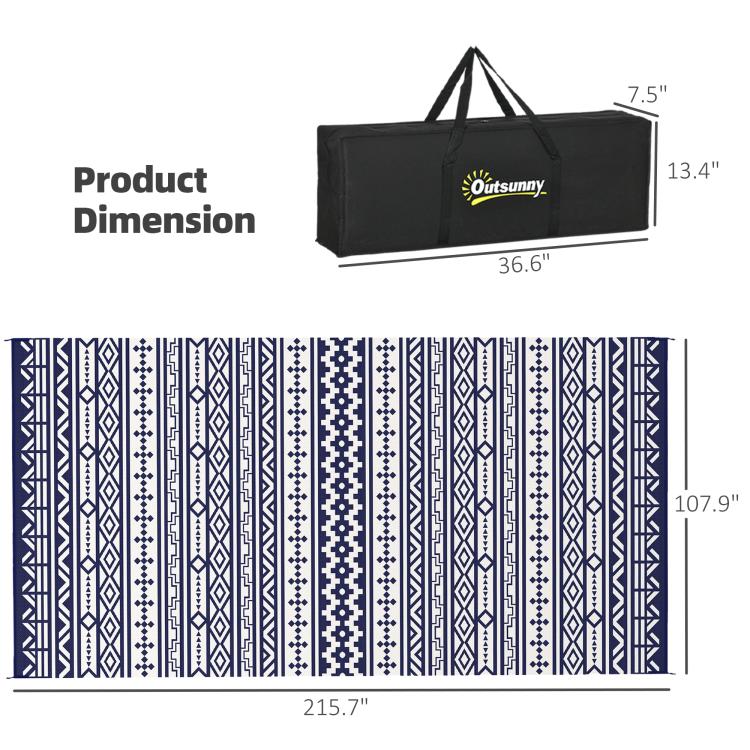 Reversible outdoor rug with blue-and-white geometric pattern, shown with carry bag