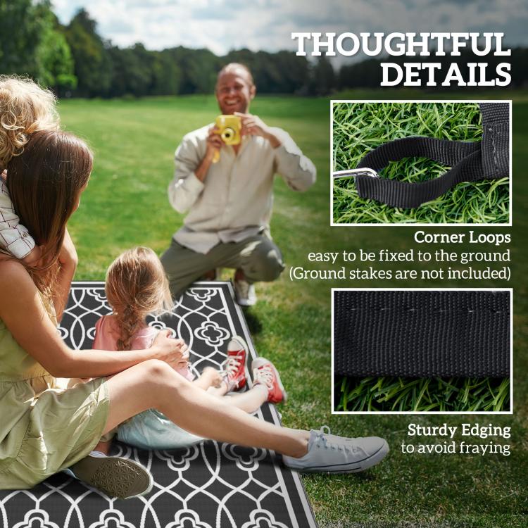 Outdoor rug corner details with black edge and white clover trellis pattern