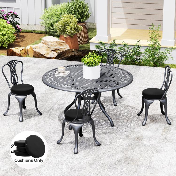 Round black seat cushions on outdoor dining chairs, patio furniture seating set