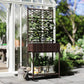 Outdoor brown wicker planter with trellis panel and storage shelf holding planters