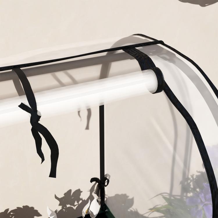 Raised garden bed cover with clear greenhouse liner and black frame, curved top