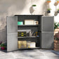 Gray outdoor wooden shed with double doors open and storage shelves inside