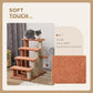 Brown cat step tower with plush carpet surfaces and mounted scratching post
