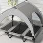 Close-up of gray canopy dog bed with black legs and mesh side panels, raised cot
