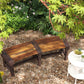 Wooden semicircular outdoor tree bench with dark brown slatted seat and back supports