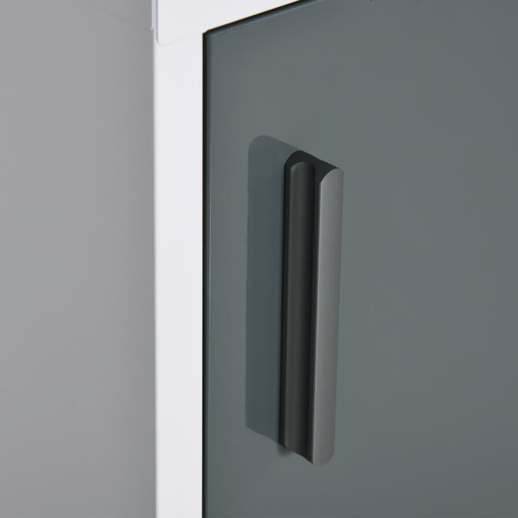 Close-up of medicine cabinet handle on dark gray door within white frame