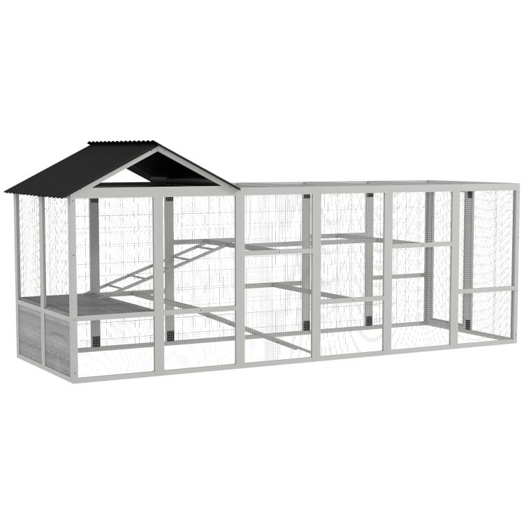 Gray outdoor chicken run enclosure with black roof and wire mesh walls, showing interior