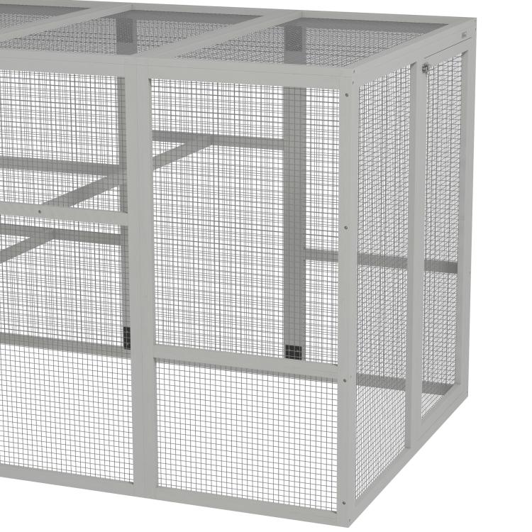 Gray wooden chicken coop run with wire mesh walls and front door
